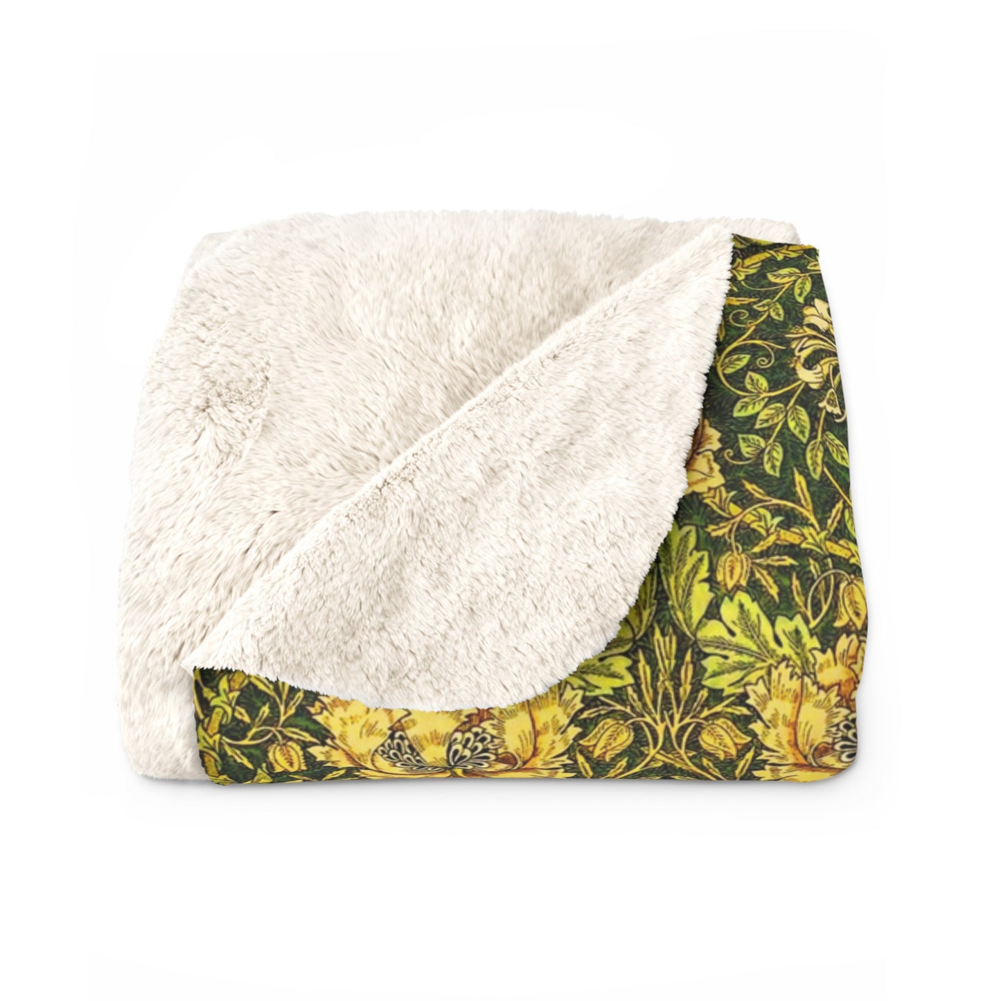 Blanket with white fleece interior and green floral exterior on a white background