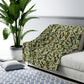 A green Sherpa fleece blanket with a floral pattern inspired by William Morris, displayed flat.