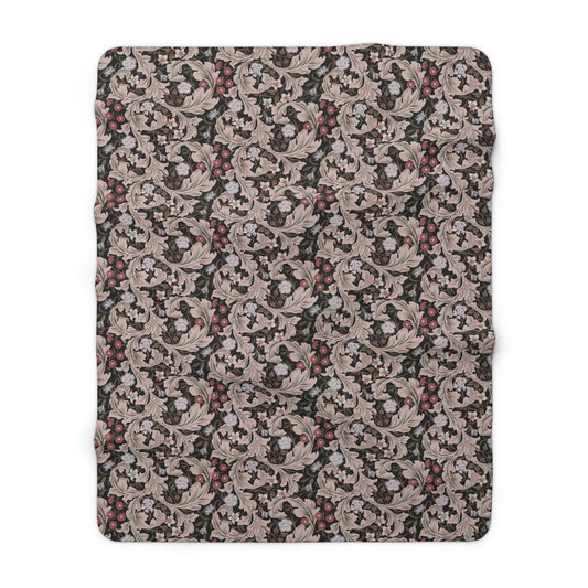 A plush fleece blanket with a floral William Morris & Co pattern in mocha colour.