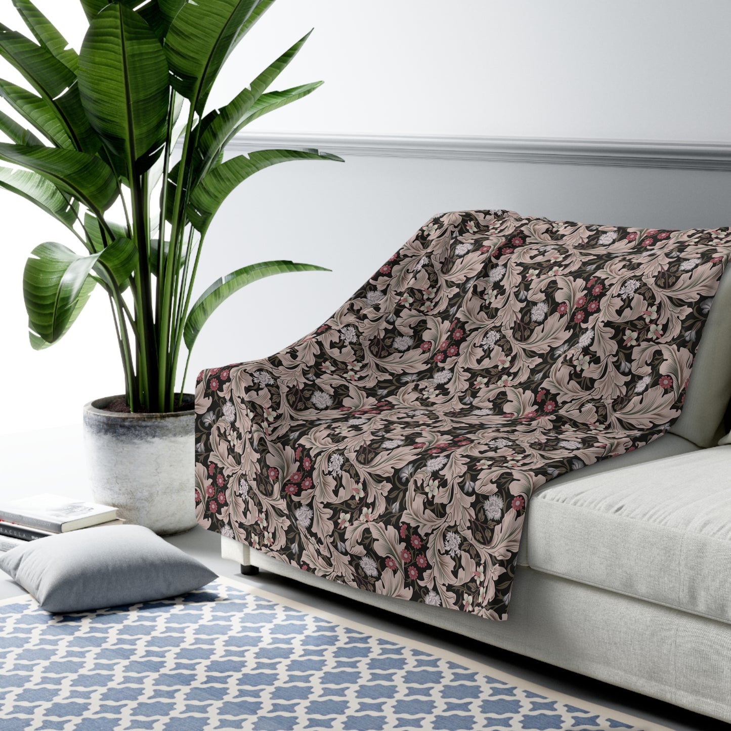 A plush fleece blanket with a floral William Morris & Co pattern in mocha colour.
