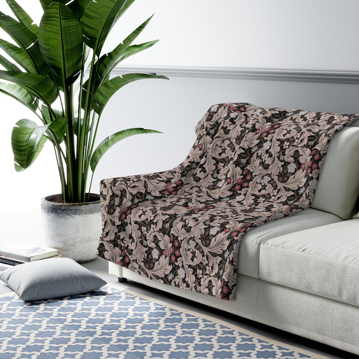 A plush fleece blanket with a floral William Morris & Co pattern in mocha colour.