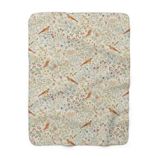 Floral and bird patterned fabric swatch on a white background