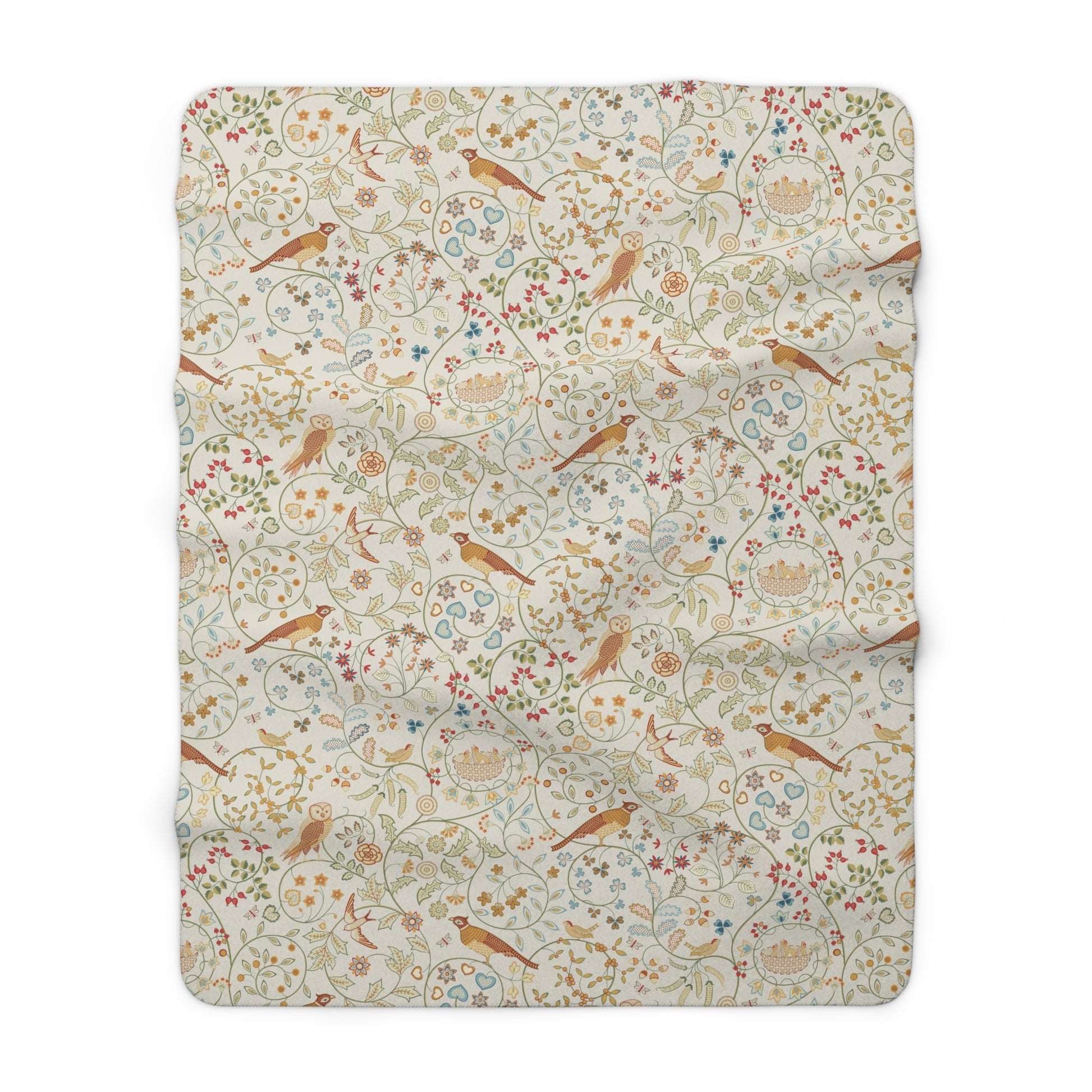 Floral and bird patterned blanket on a white background