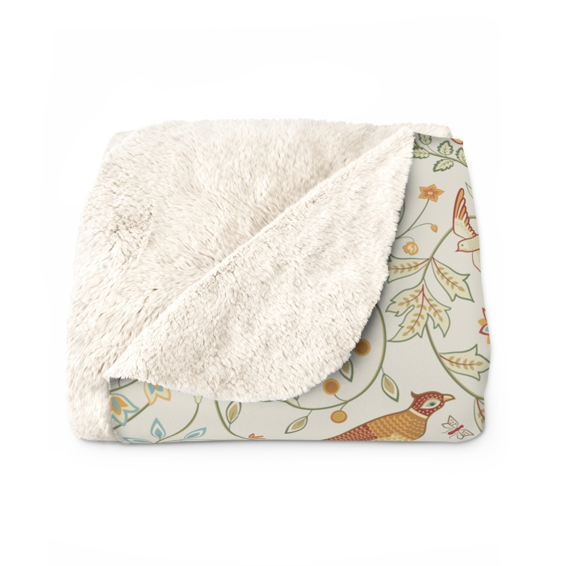 Floral patterned blanket with white sherpa lining on a white background