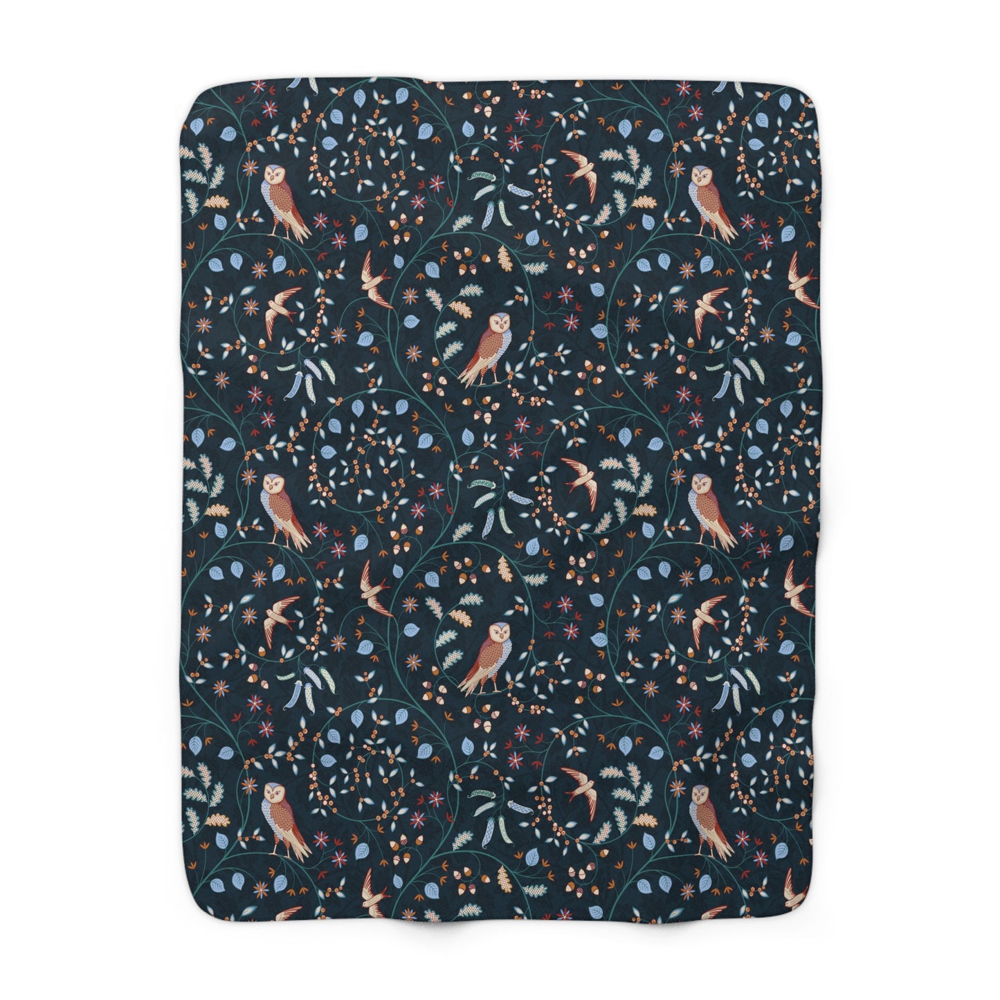 Floral and bird patterned blanket on a white background