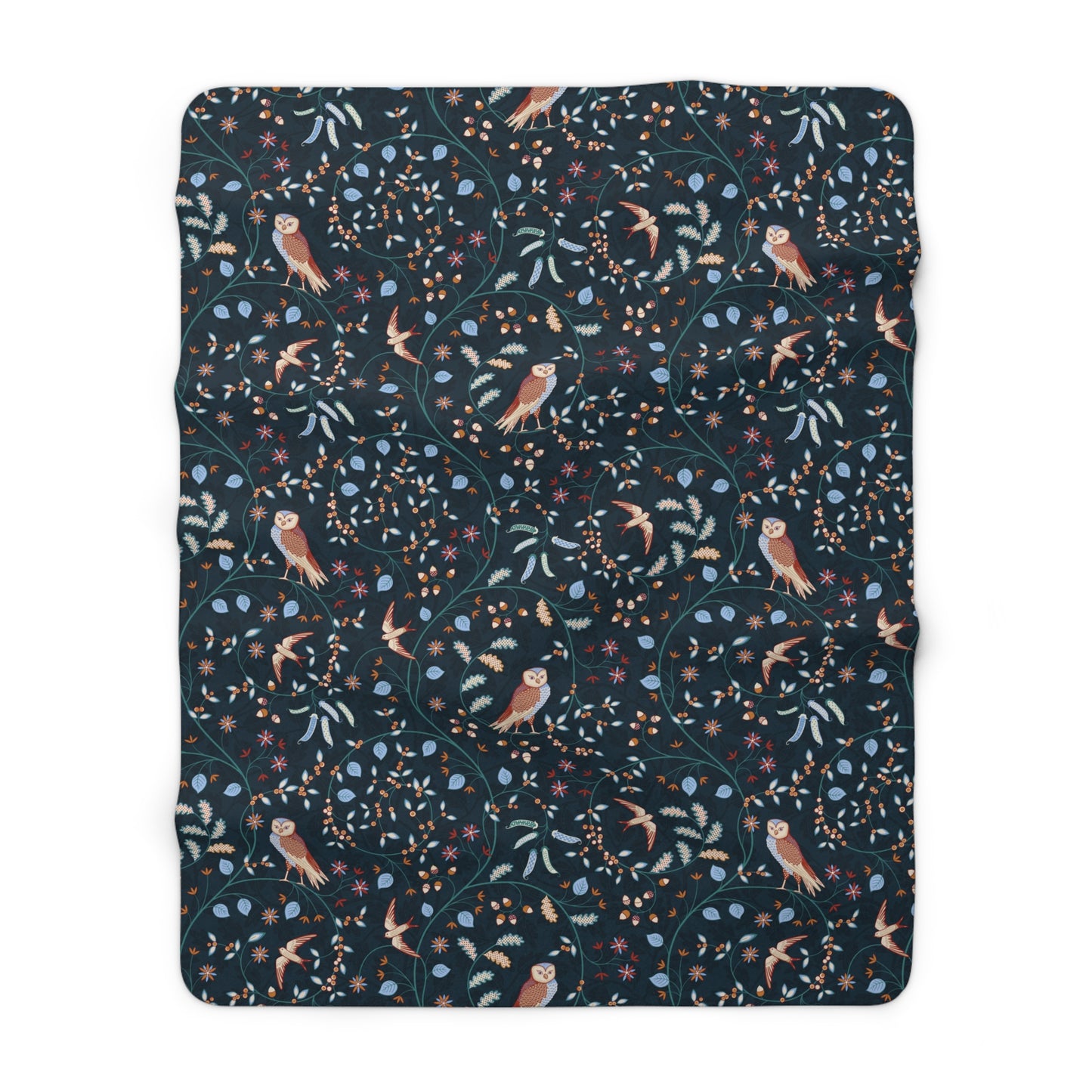 Floral and bird patterned blanket on a white background