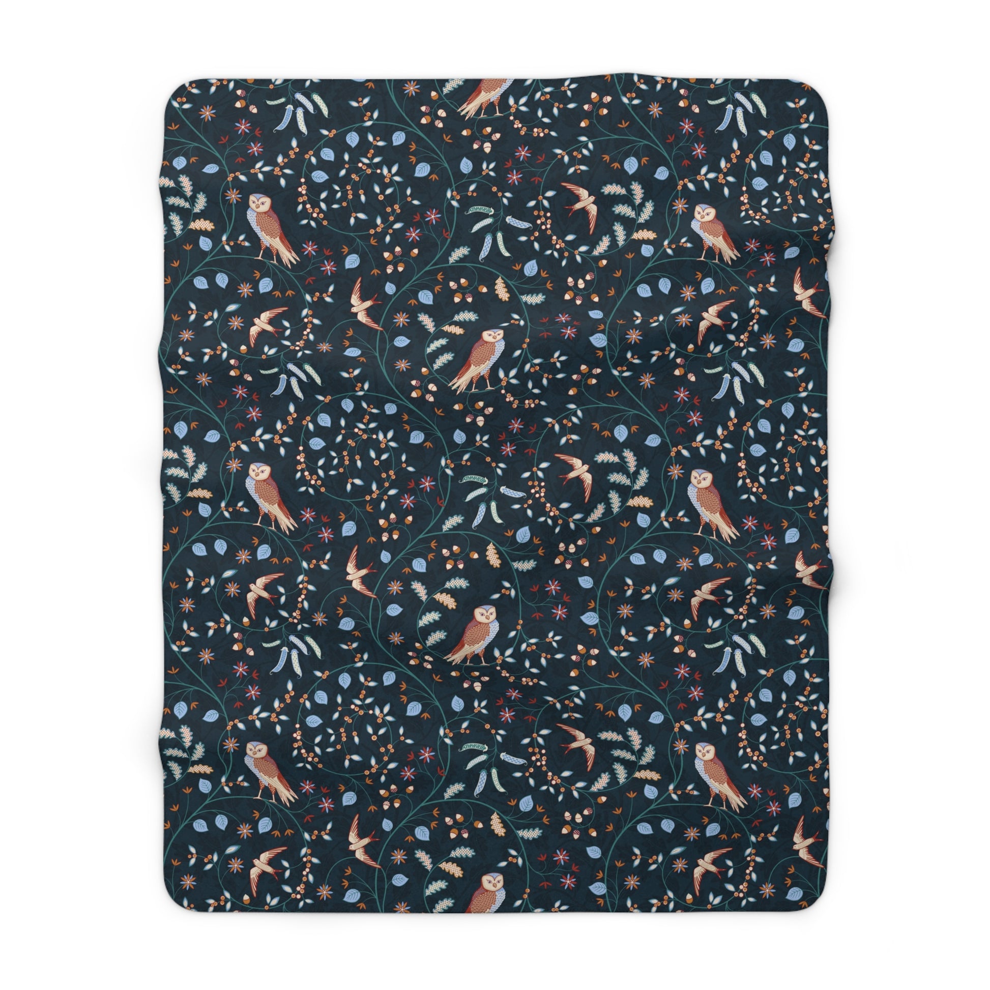 Floral and bird patterned blanket on a white background