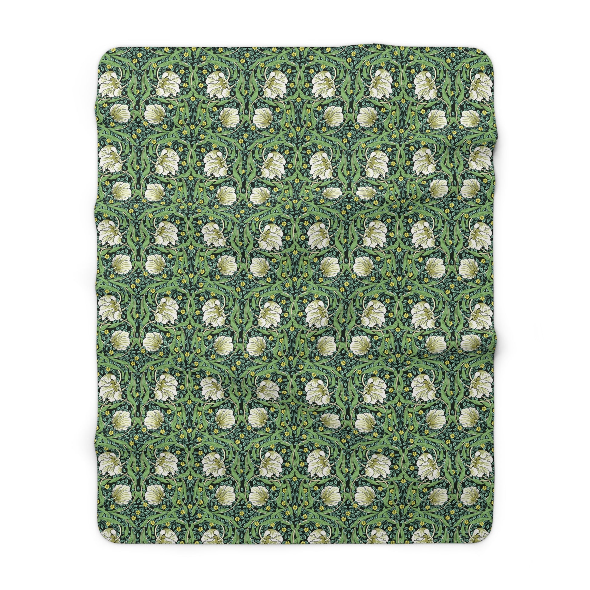 A green Sherpa fleece blanket with a floral pattern inspired by William Morris.