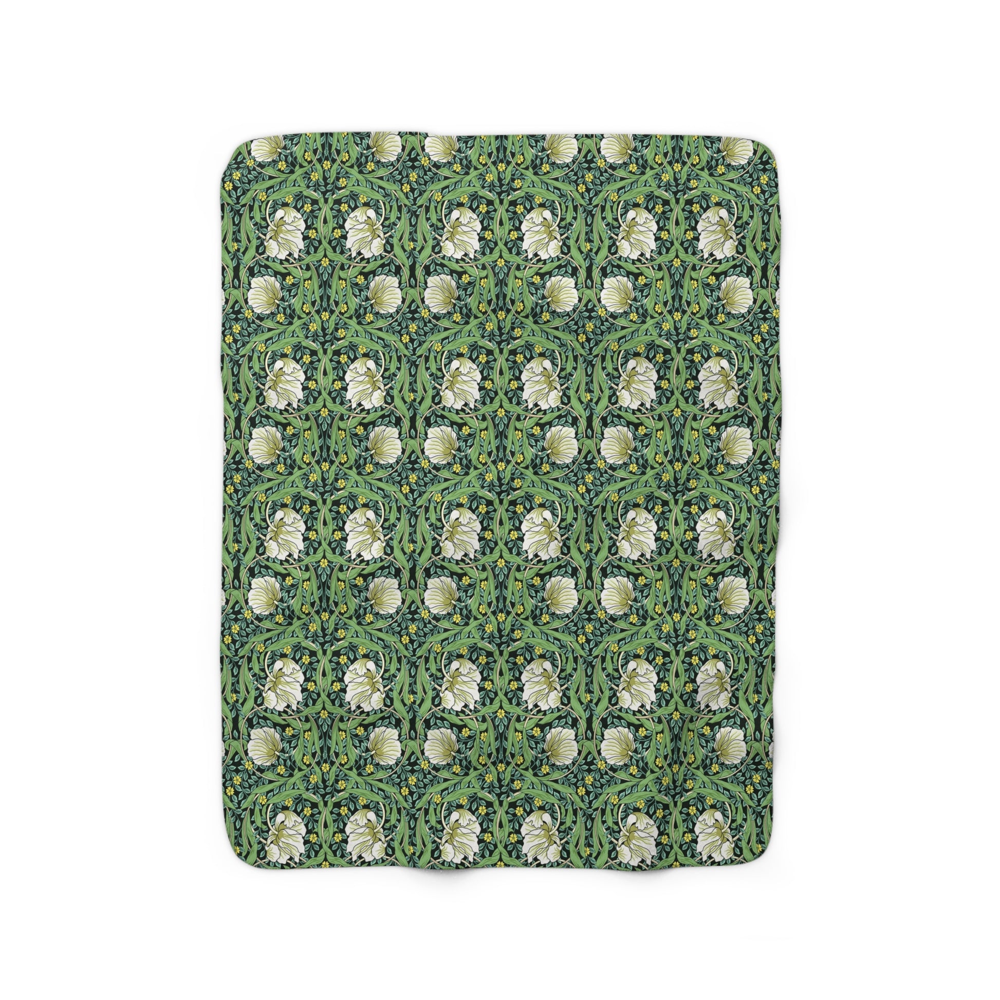A green Sherpa fleece blanket with a floral pattern inspired by William Morris.