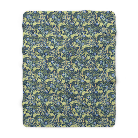 A rectangular Sherpa fleece blanket with a floral pattern in blue and yellow shades, inspired by William Morris & Co