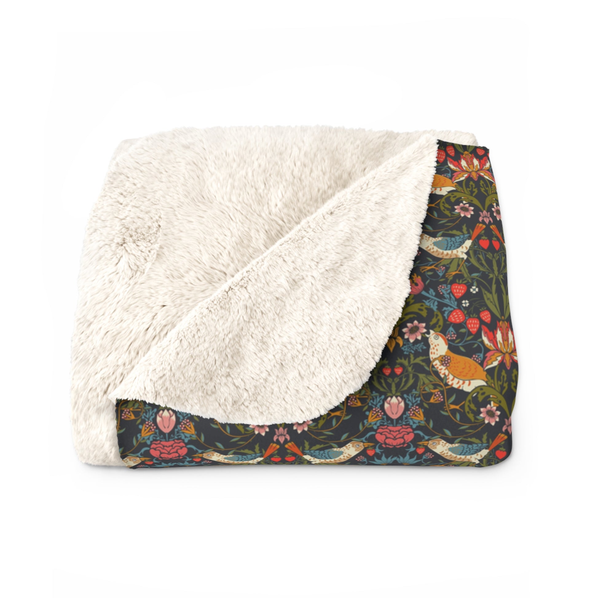 Floral patterned blanket with white sherpa lining on a white background