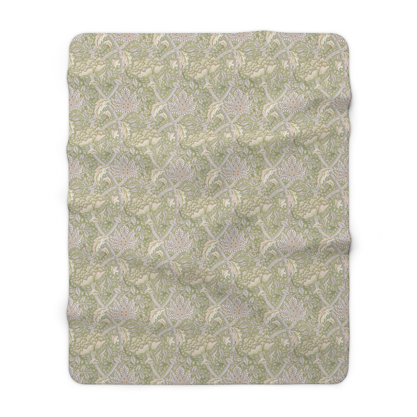 A plush fleece blanket with a floral pattern in green and white tones, inspired by William Morris.