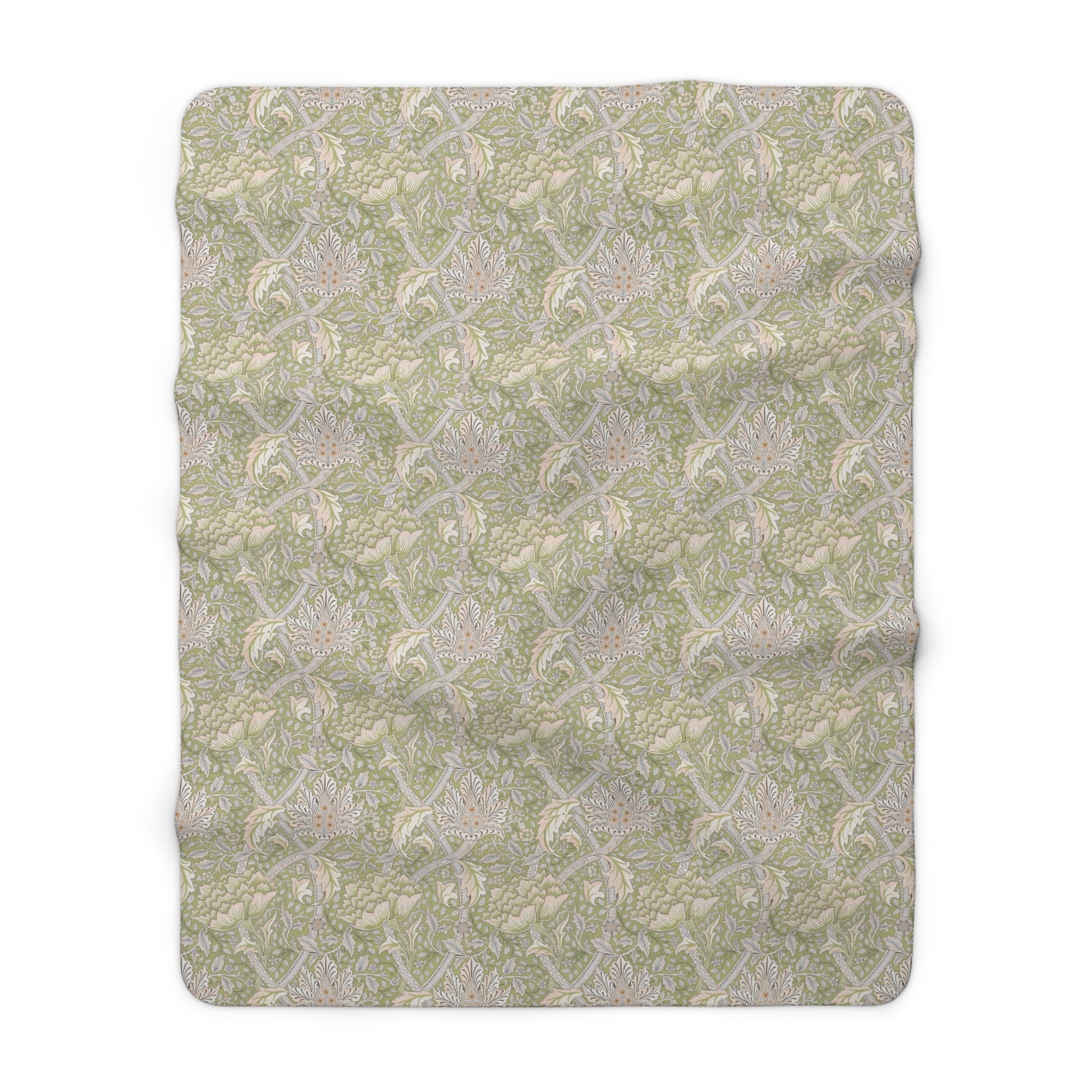 A plush fleece blanket with a floral pattern in green and white tones, inspired by William Morris.