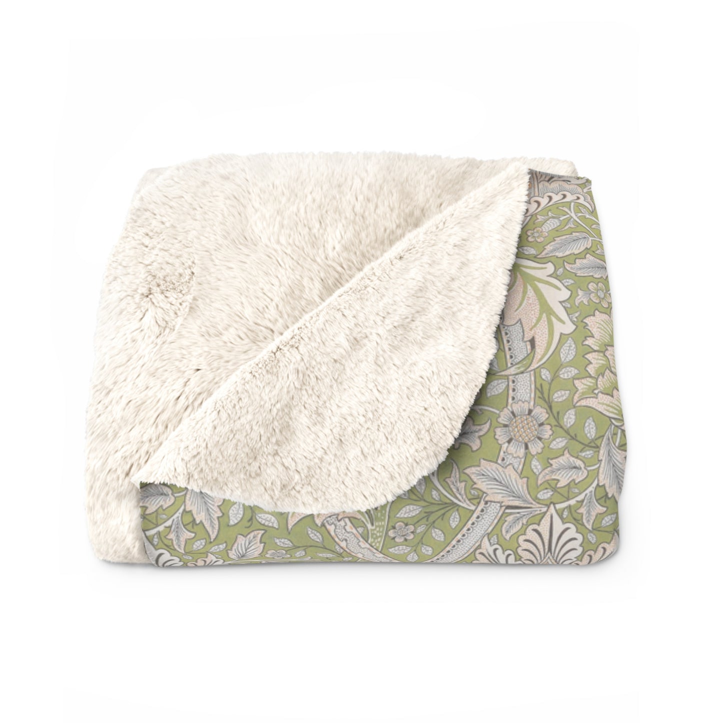 A plush fleece blanket with a floral pattern in green and white tones, inspired by William Morris.