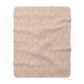 A beige and brown patterned Sherpa fleece blanket inspired by William Morris, from the Windrush Collection.