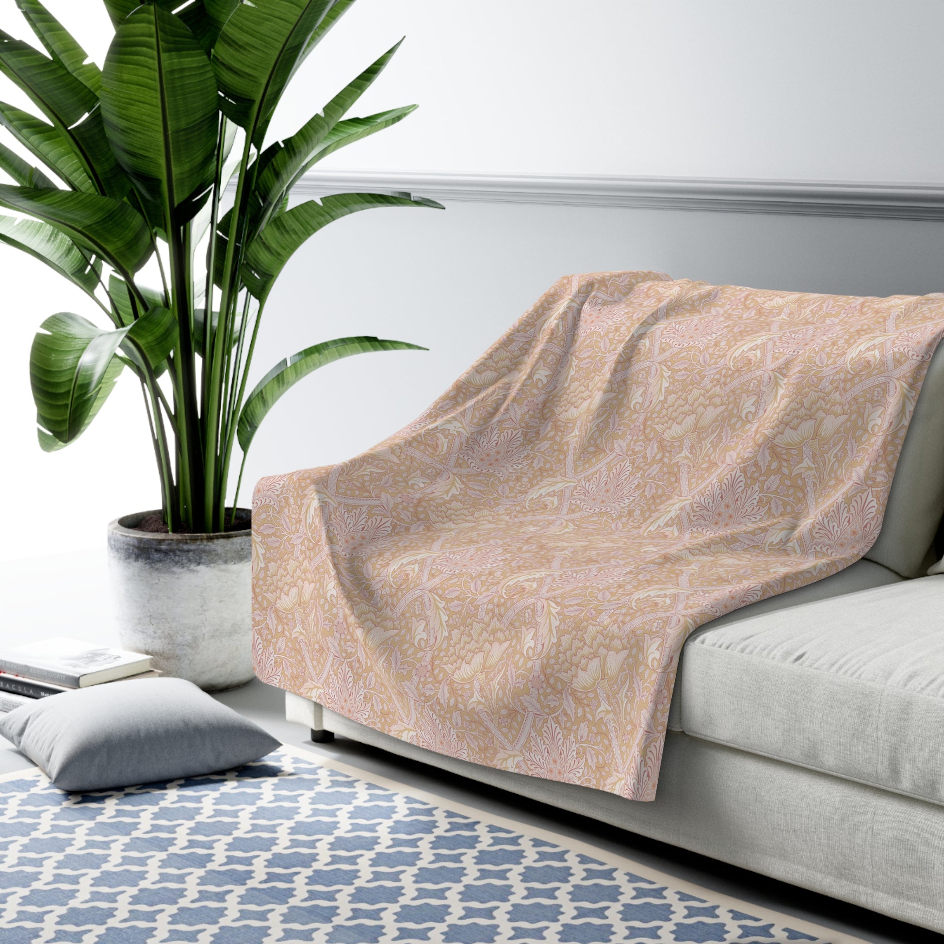 A beige and brown patterned Sherpa fleece blanket inspired by William Morris, from the Windrush Collection.