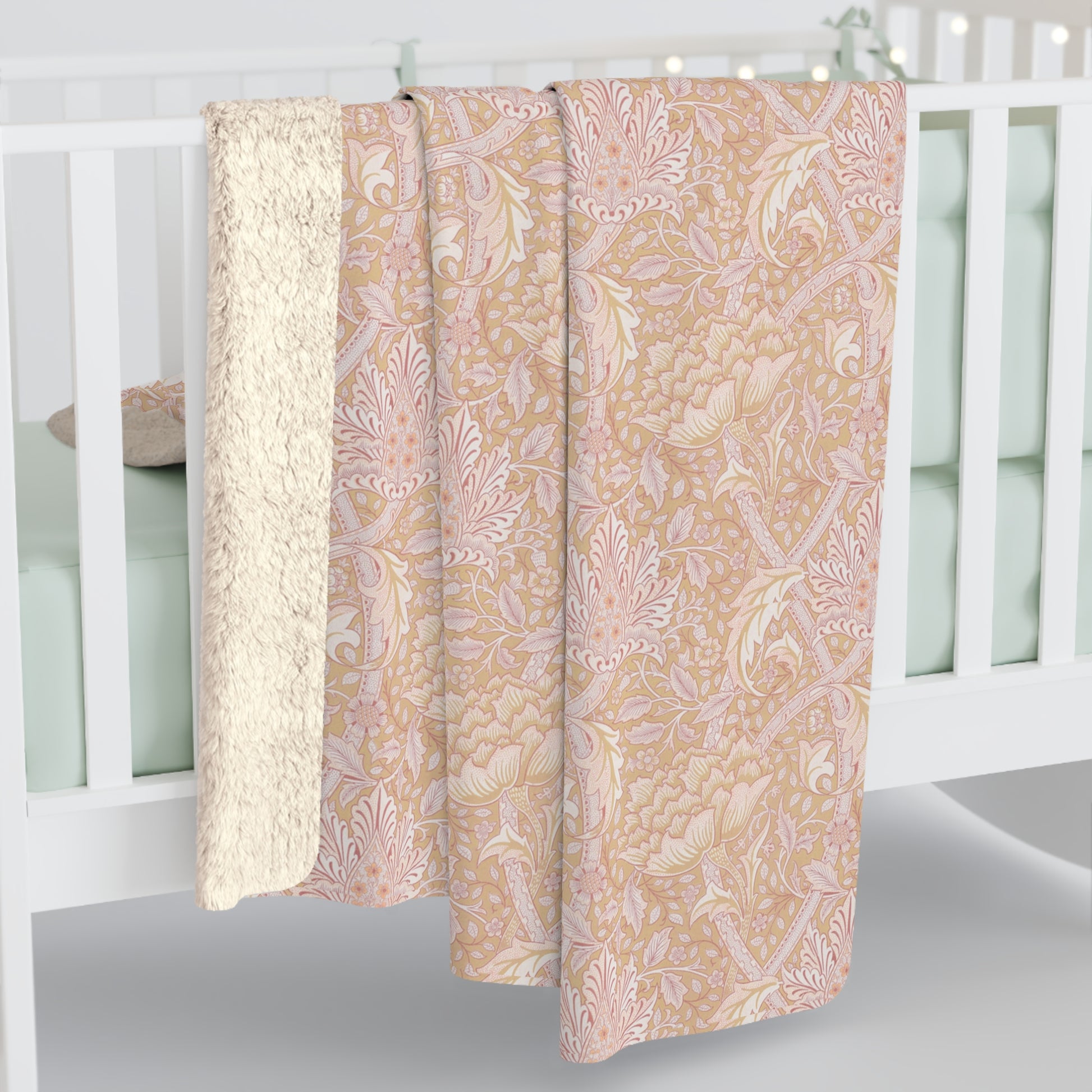 A beige and brown patterned Sherpa fleece blanket inspired by William Morris, from the Windrush Collection.