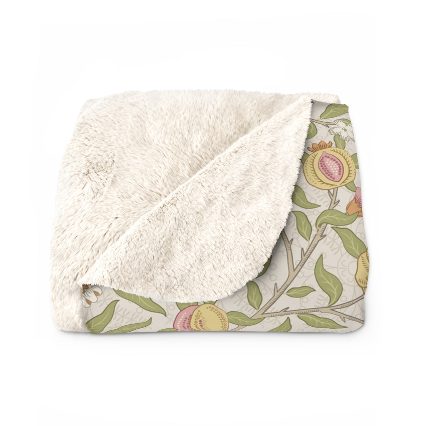 Floral-patterned blanket with white sherpa lining on a white background
