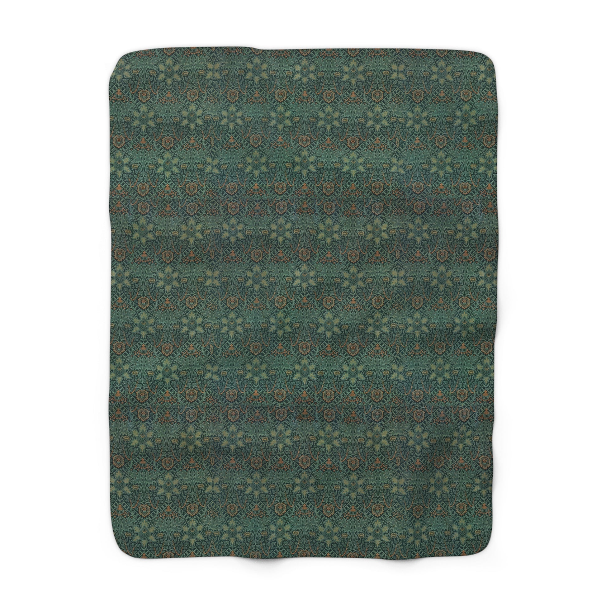 A Sherpa fleece blanket with a floral pattern in green and brown colors, draped over a couch.