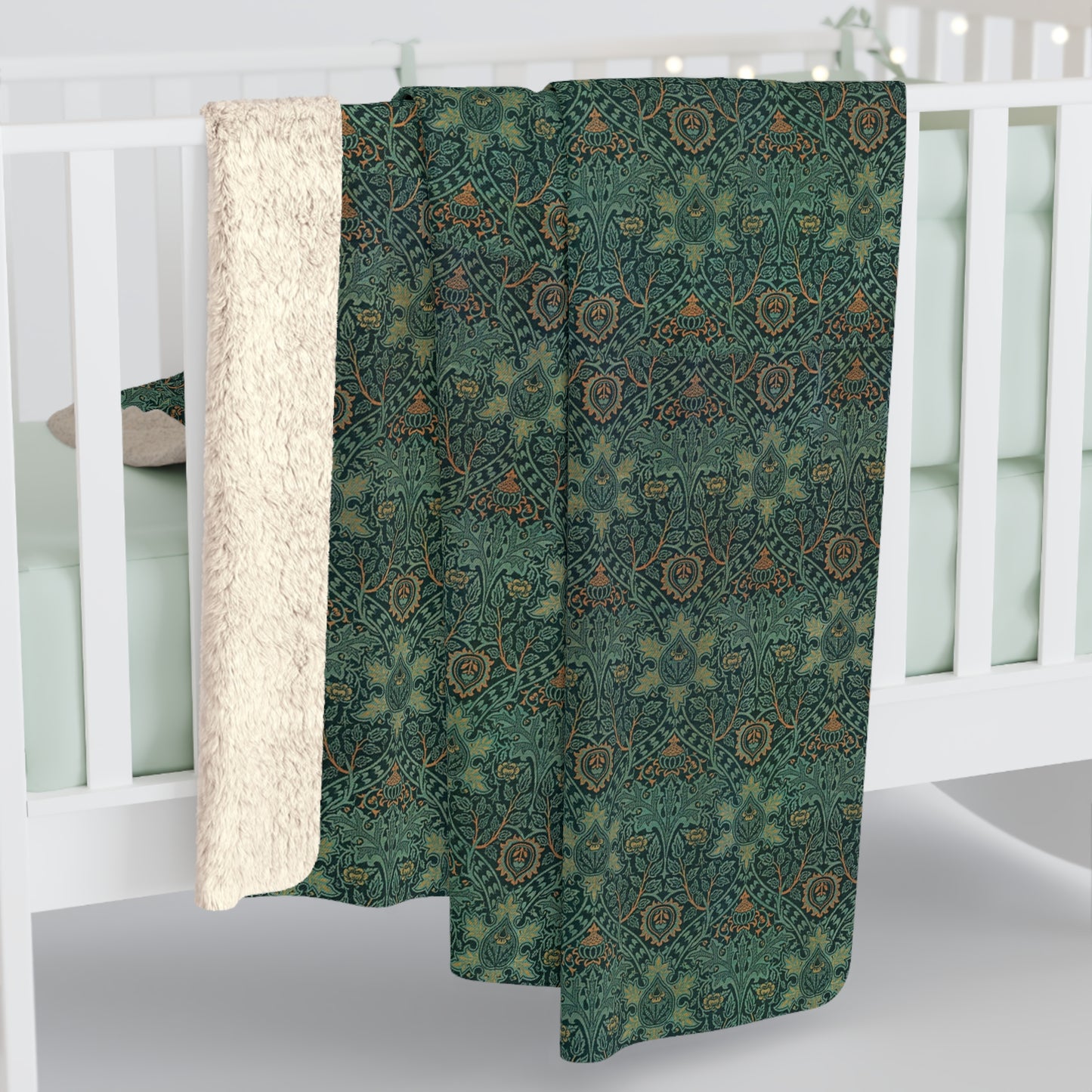 A Sherpa fleece blanket with a floral pattern in green and brown tones, underside showing plush cream sherpa fleece.