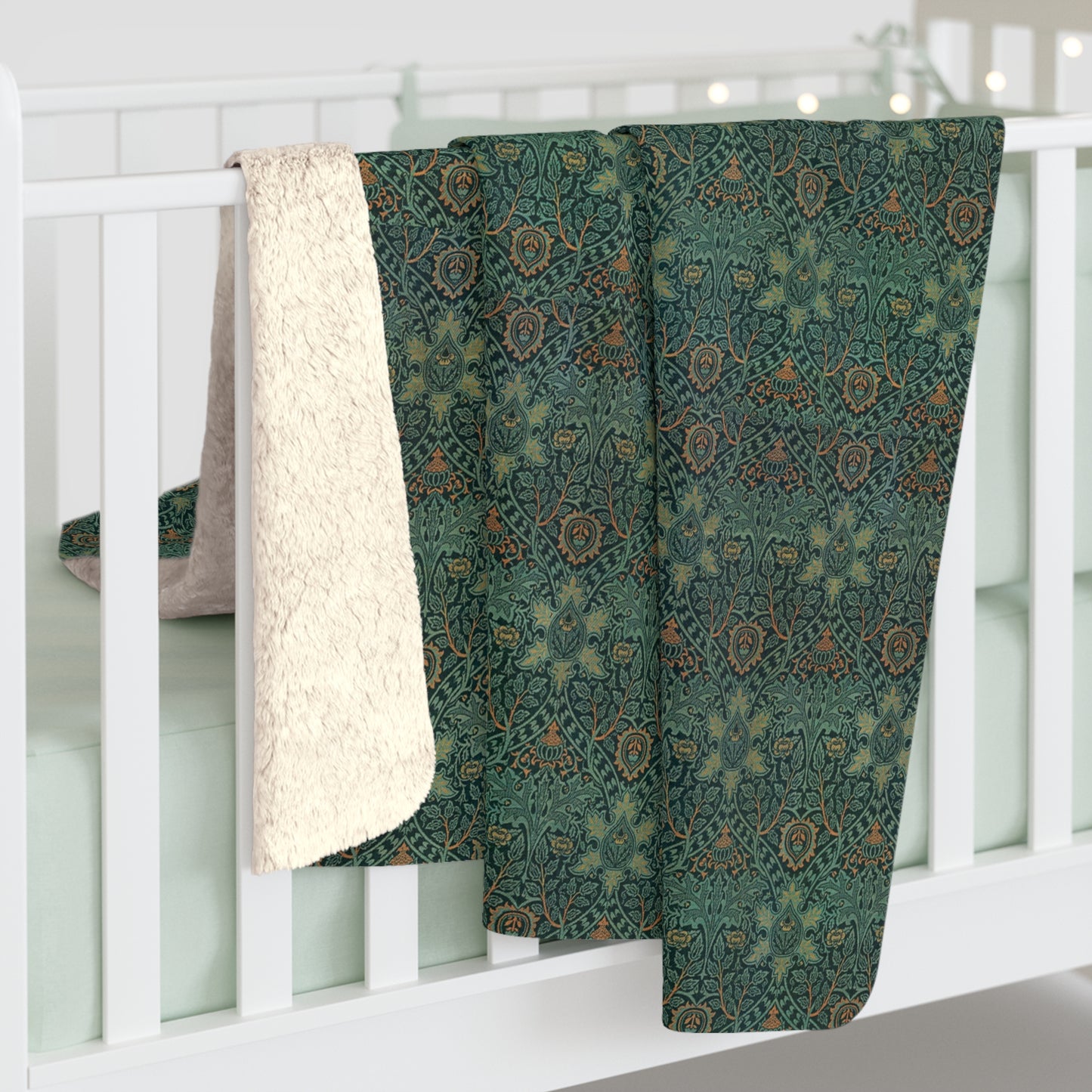 A Sherpa fleece blanket with a floral pattern in green and brown tones, underside showing plush cream sherpa fleece.