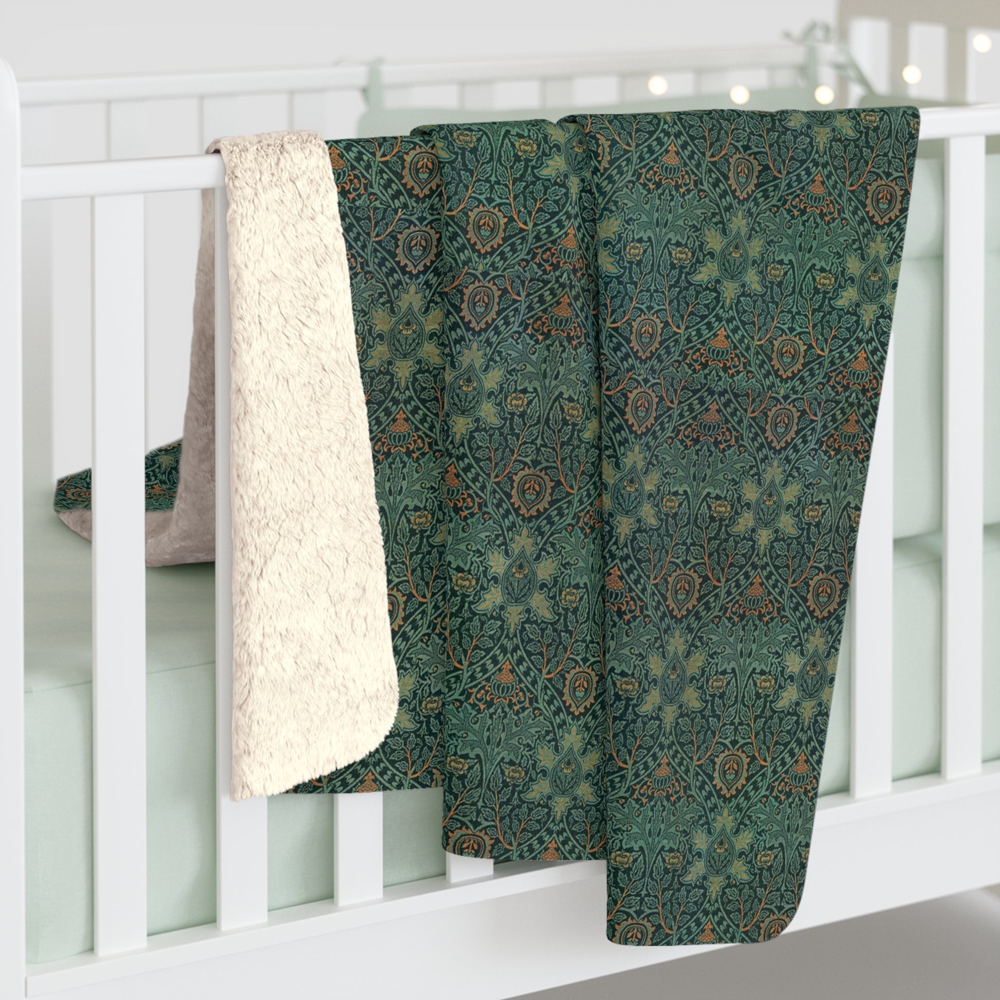 A Sherpa fleece blanket with a floral pattern in green and brown tones, underside showing plush cream sherpa fleece.