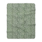 A green Sherpa fleece blanket with a floral pattern inspired by William Morris, displayed flat.