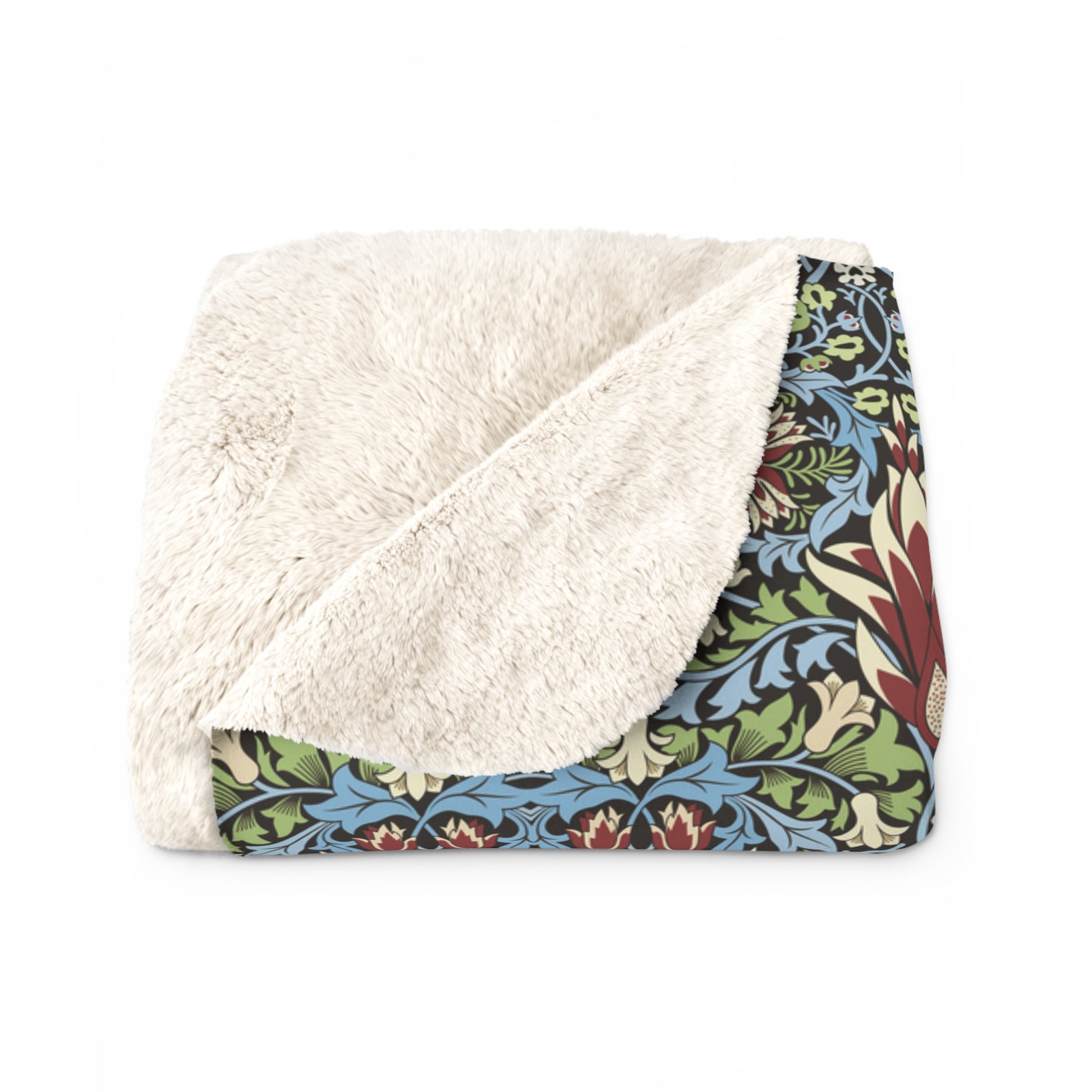Floral-patterned blanket with white sherpa lining on a white background from William Morris