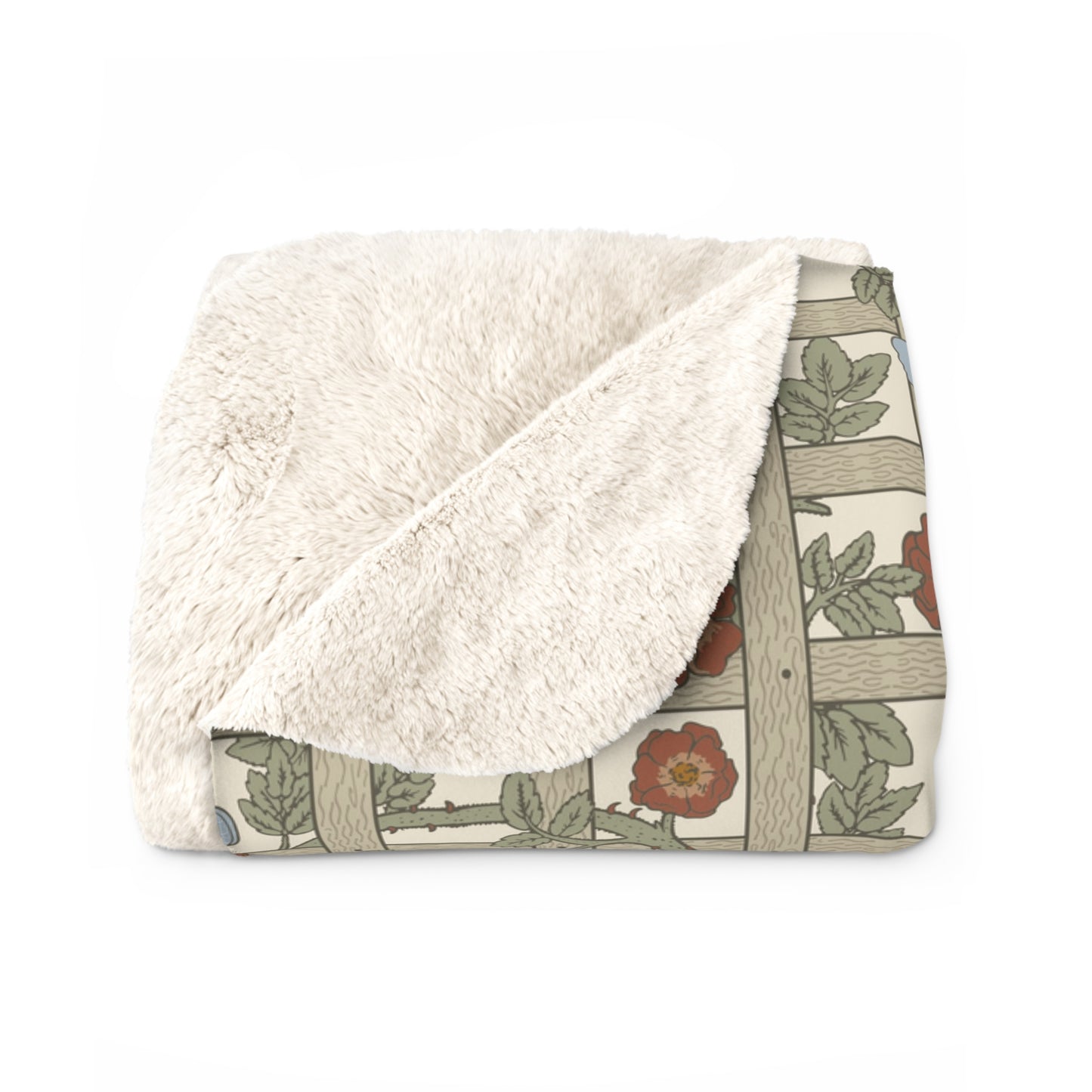A Sherpa fleece blanket with a floral pattern in beige, green, blue, and red colours on a white background.