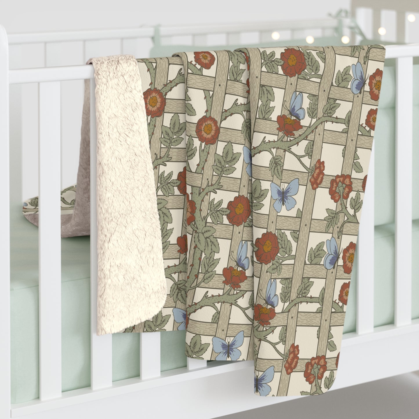 A Sherpa fleece blanket with a floral pattern in beige, green, blue, and red colours on a white background.