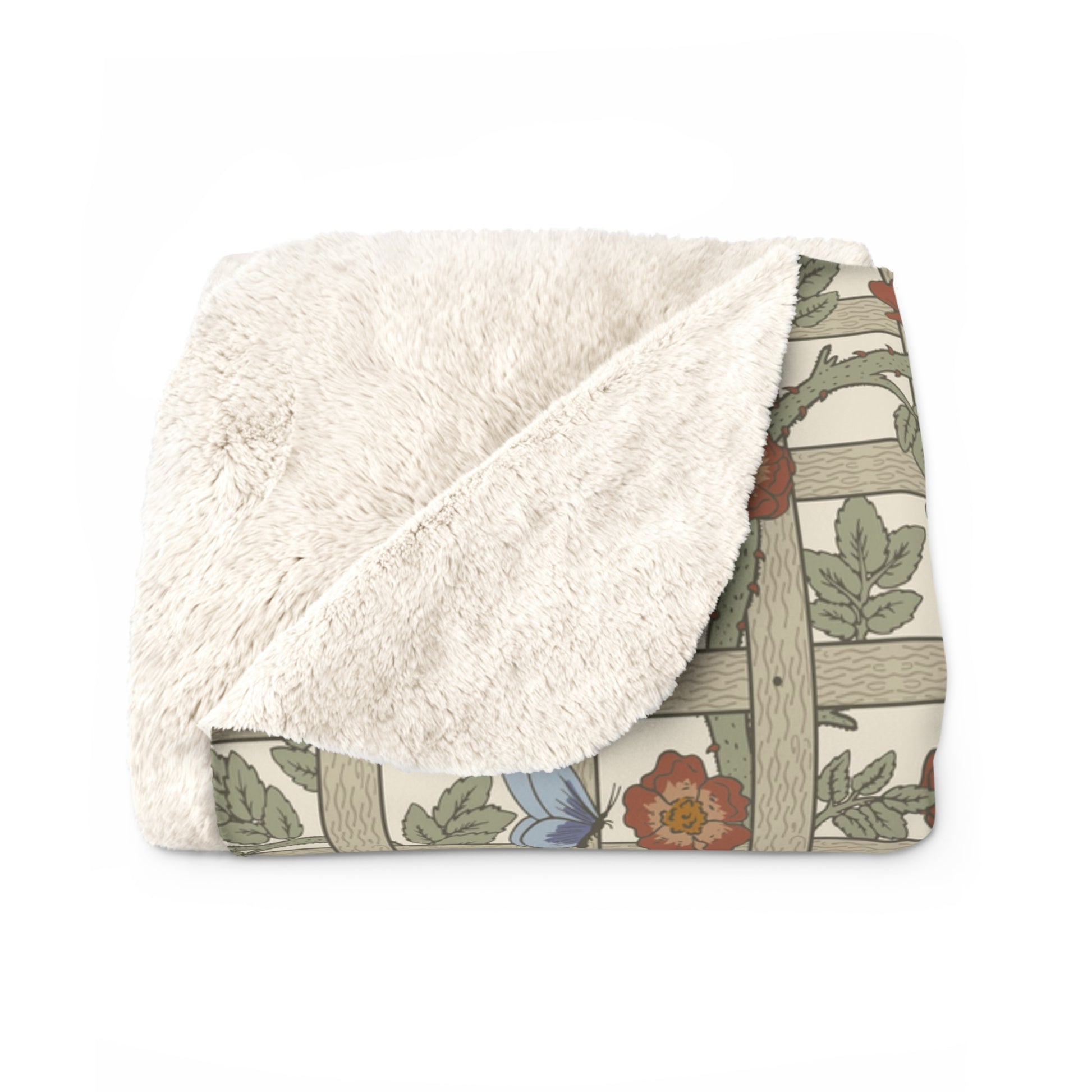 A Sherpa fleece blanket with a floral pattern in beige, green, blue, and red colours on a white background.
