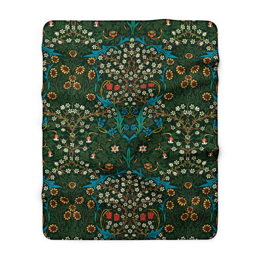 Decorative blanket with intricate floral pattern on a green background