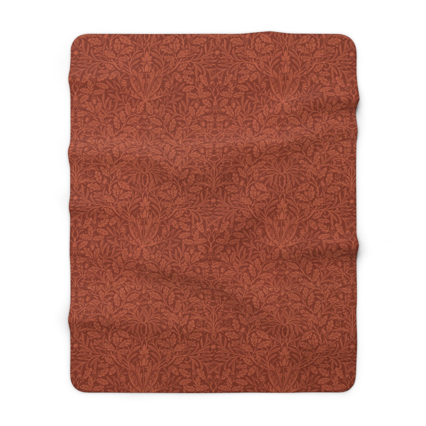A rectangular Sherpa fleece blanket with a rust-coloured floral pattern inspired by William Morris & Co - Acorns and Oak Trees Collection.