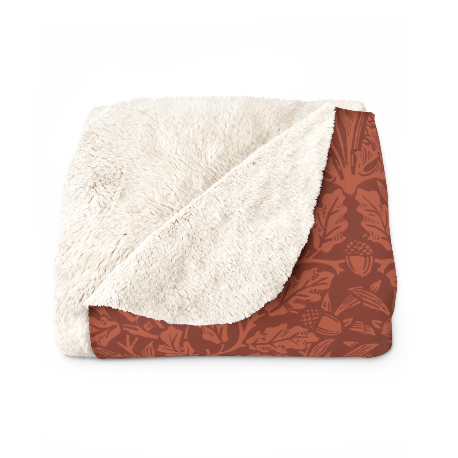 A rectangular Sherpa fleece blanket with a rust-coloured floral pattern inspired by William Morris & Co - Acorns and Oak Trees Collection.
