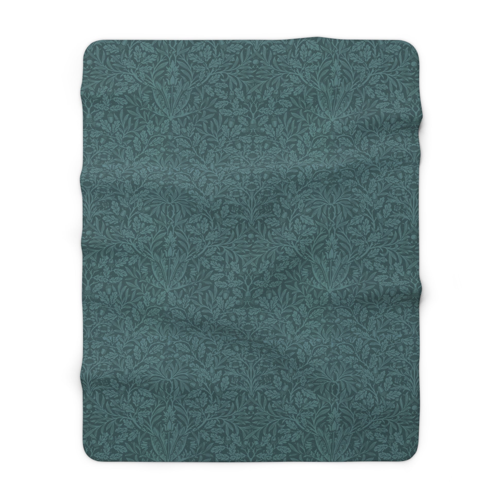 A rectangular Sherpa fleece blanket with a teal colour and a floral pattern inspired by William Morris - Acorns and Oak Trees Collection.