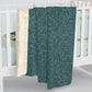 A rectangular Sherpa fleece blanket with a teal colour and a floral pattern inspired by William Morris - Acorns and Oak Trees Collection.