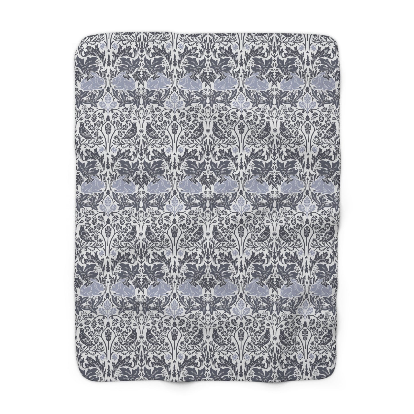 A grey Sherpa fleece blanket with a floral pattern, inspired by William Morris, from the Brer Rabbit collection.