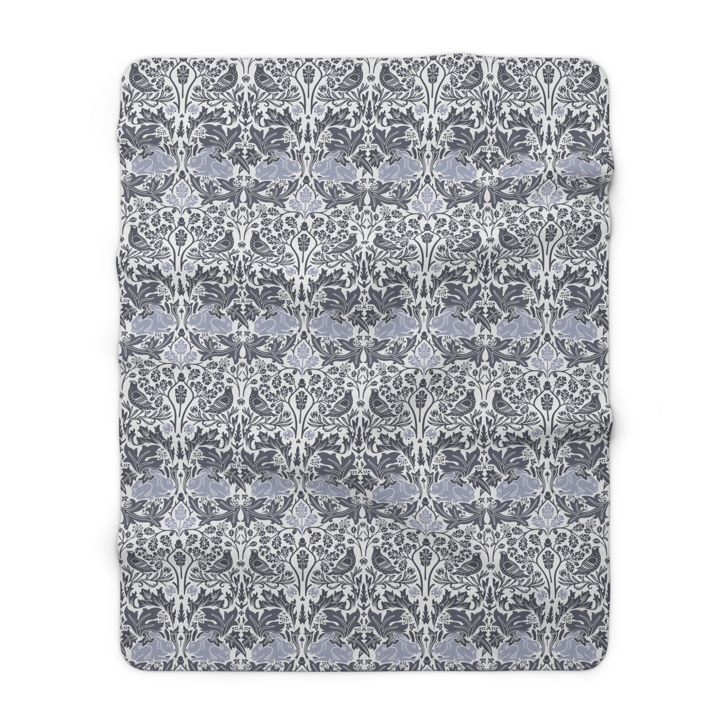 A grey Sherpa fleece blanket with a floral pattern, inspired by William Morris, from the Brer Rabbit collection.