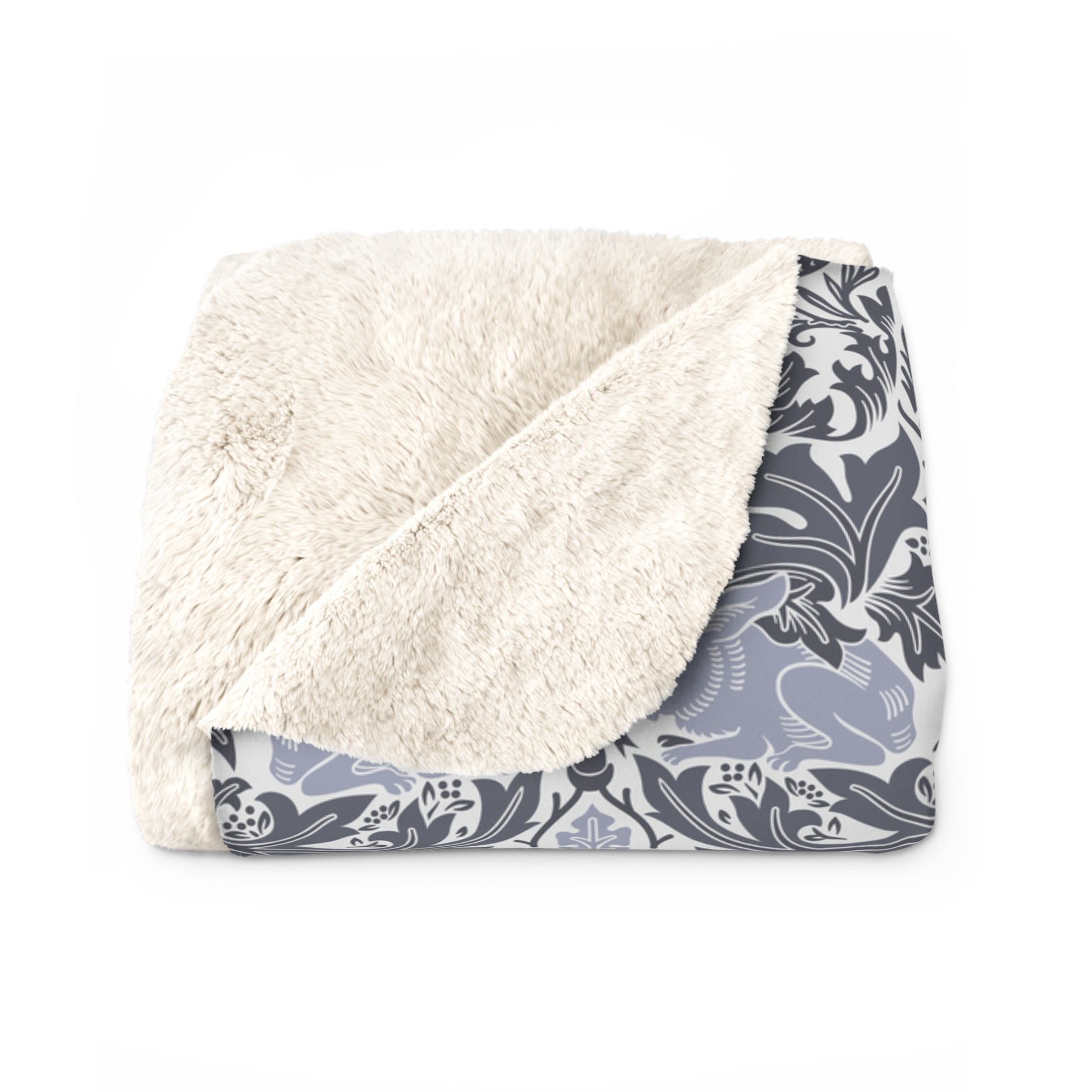 A grey Sherpa fleece blanket with a floral pattern, inspired by William Morris, from the Brer Rabbit collection.