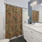 Bathroom with a patterned shower curtain, white vanity, and mirror.