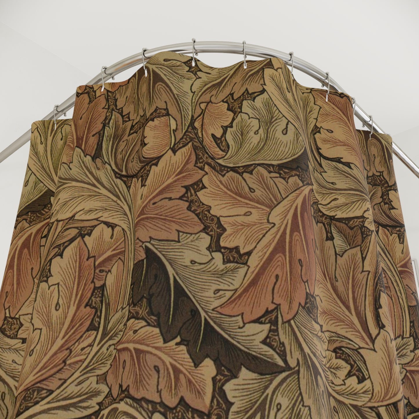 Floral patterned fabric on a metal rod against a white background