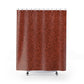 Red patterned shower curtain on a white background