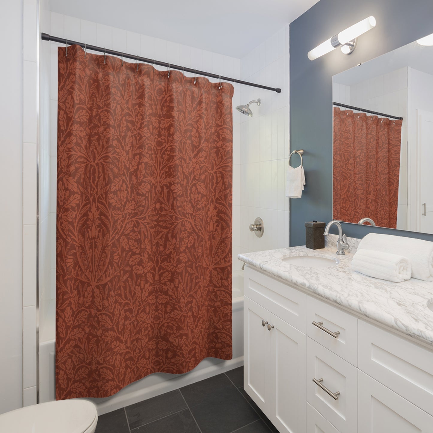 Bathroom with a red patterned shower curtain, white vanity, and mirror.