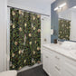 Bathroom with a patterned shower curtain, white vanity, and mirror.