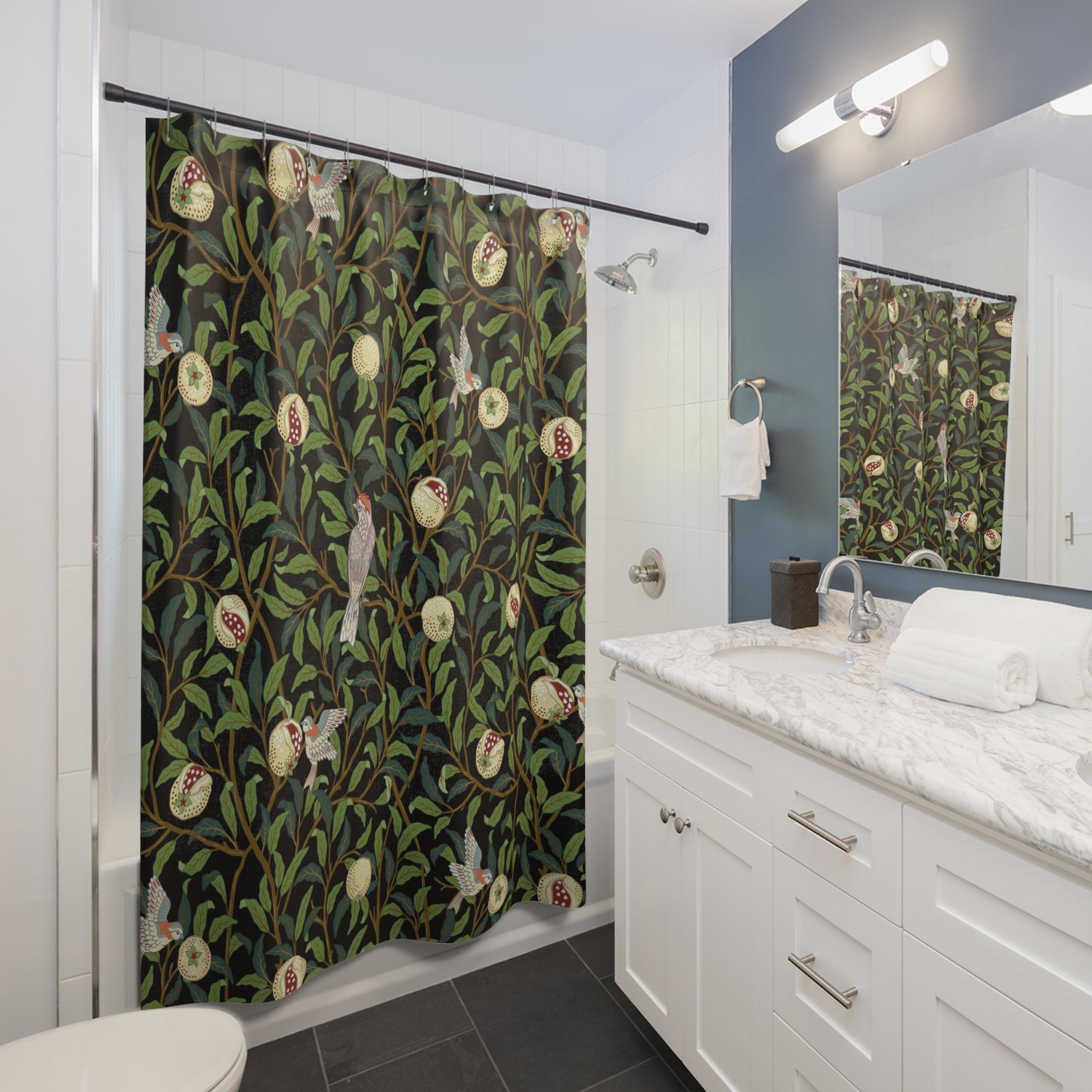 Bathroom with a patterned shower curtain, white vanity, and mirror.