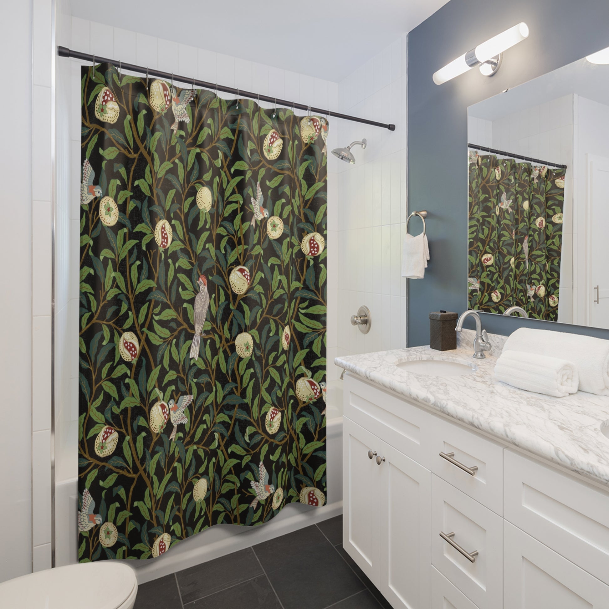 Bathroom with a patterned shower curtain, white vanity, and mirror.