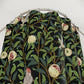 Fabric with nature-themed design featuring leaves, birds, and flowers on a black background.