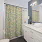 Bathroom with a patterned shower curtain, sink, and mirror.