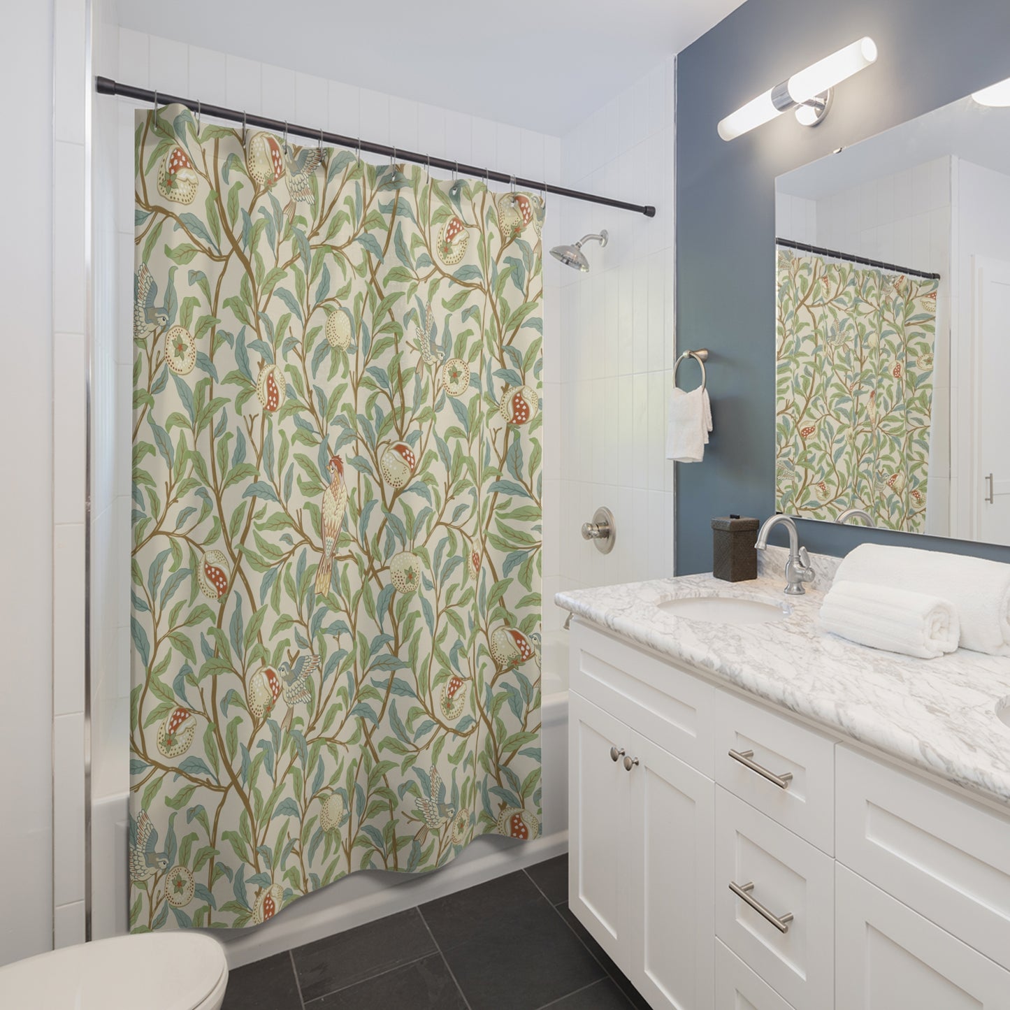 Bathroom with a patterned shower curtain, sink, and mirror.