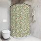 Bathroom with a floral-patterned shower curtain and a white toilet.